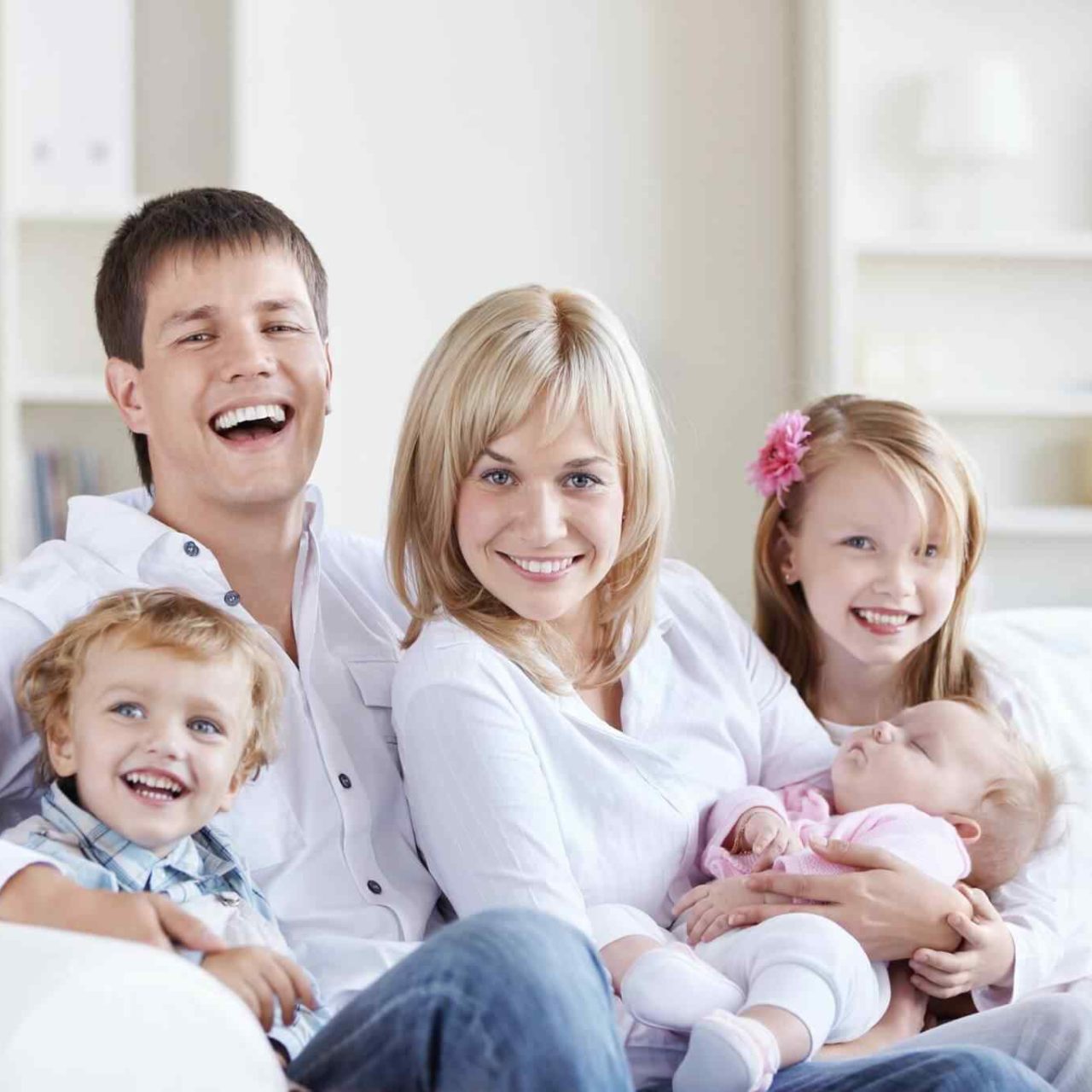 
				A happy family with three children at home		